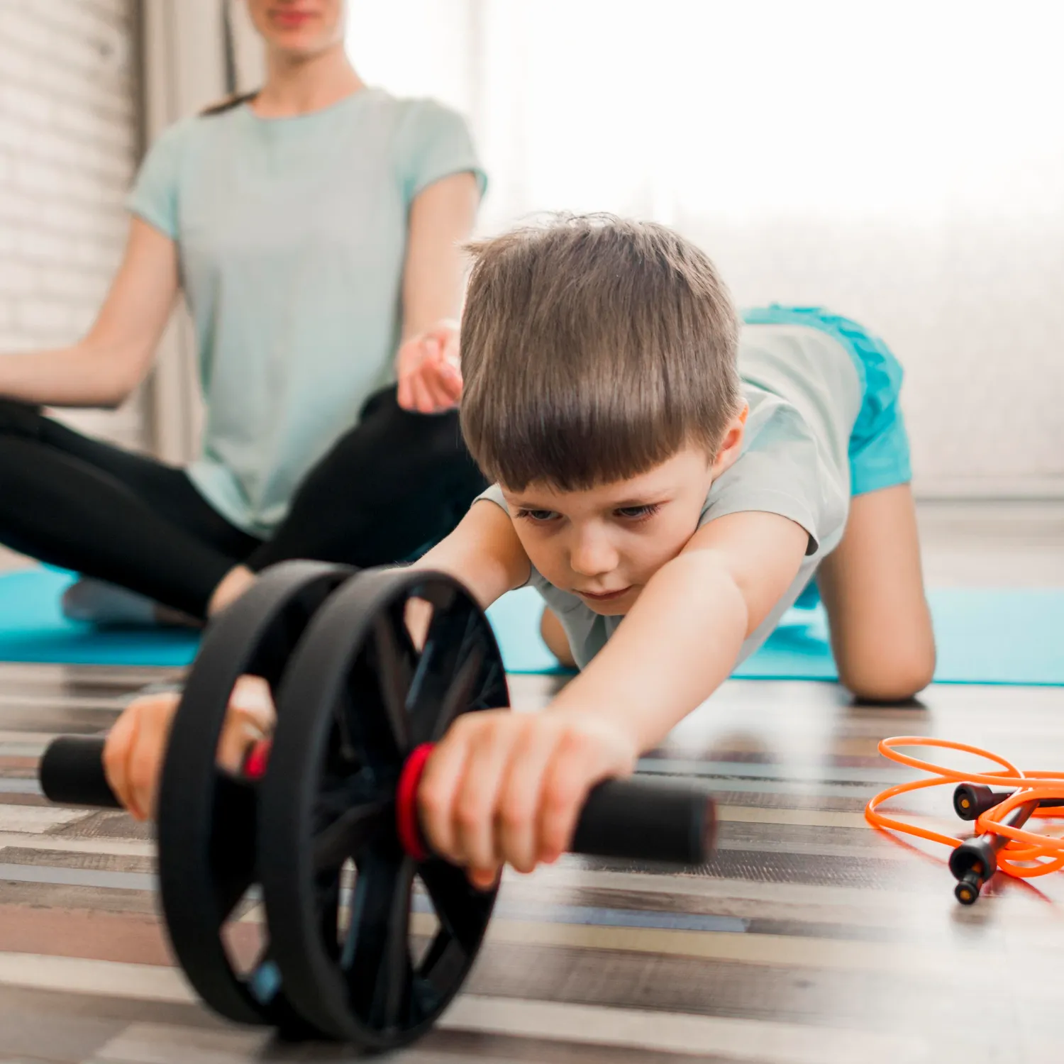 Cute little boy training with mother at home Cute little boy training with mother at home<br />