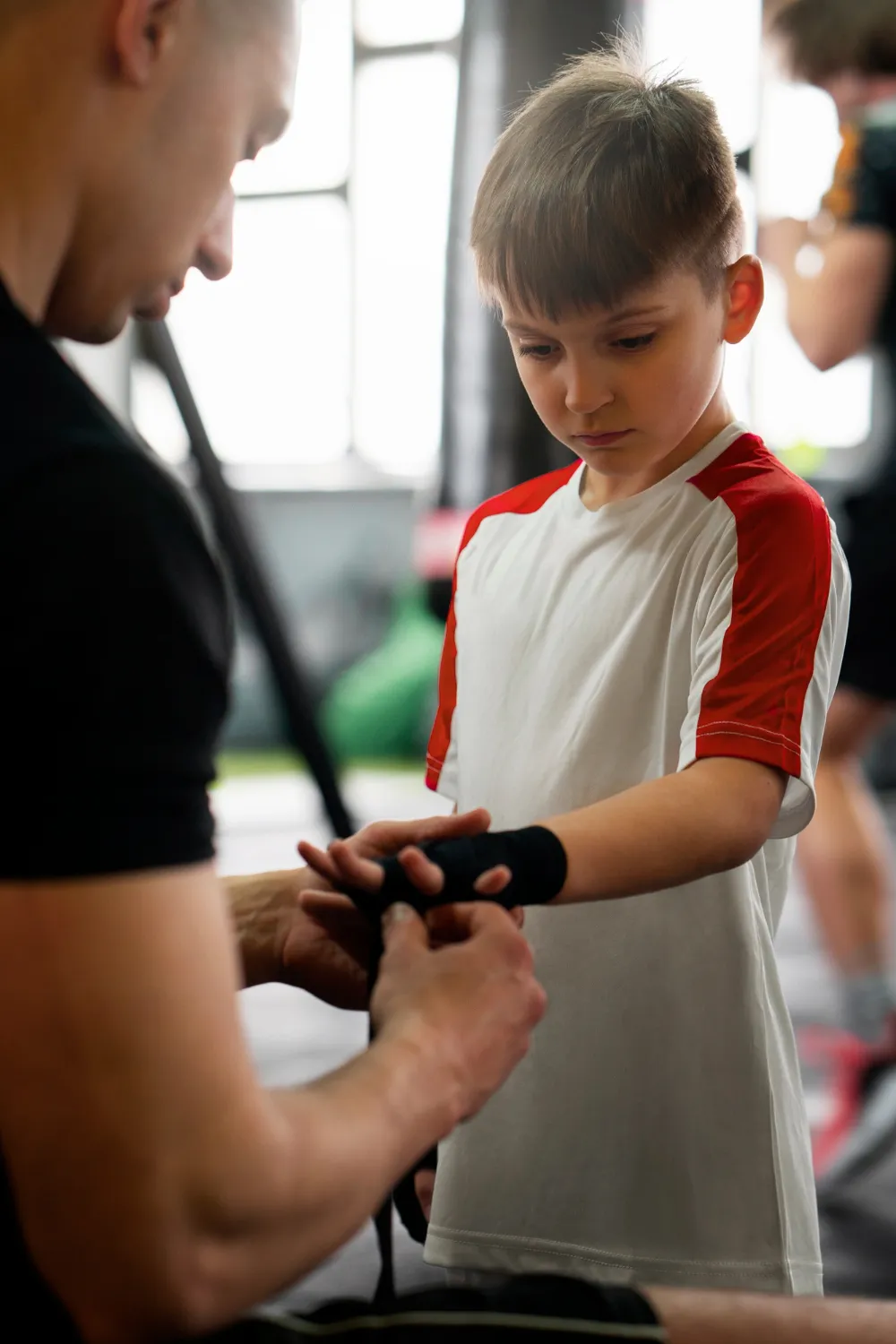 2150422459 Side view boy training at gym<br />