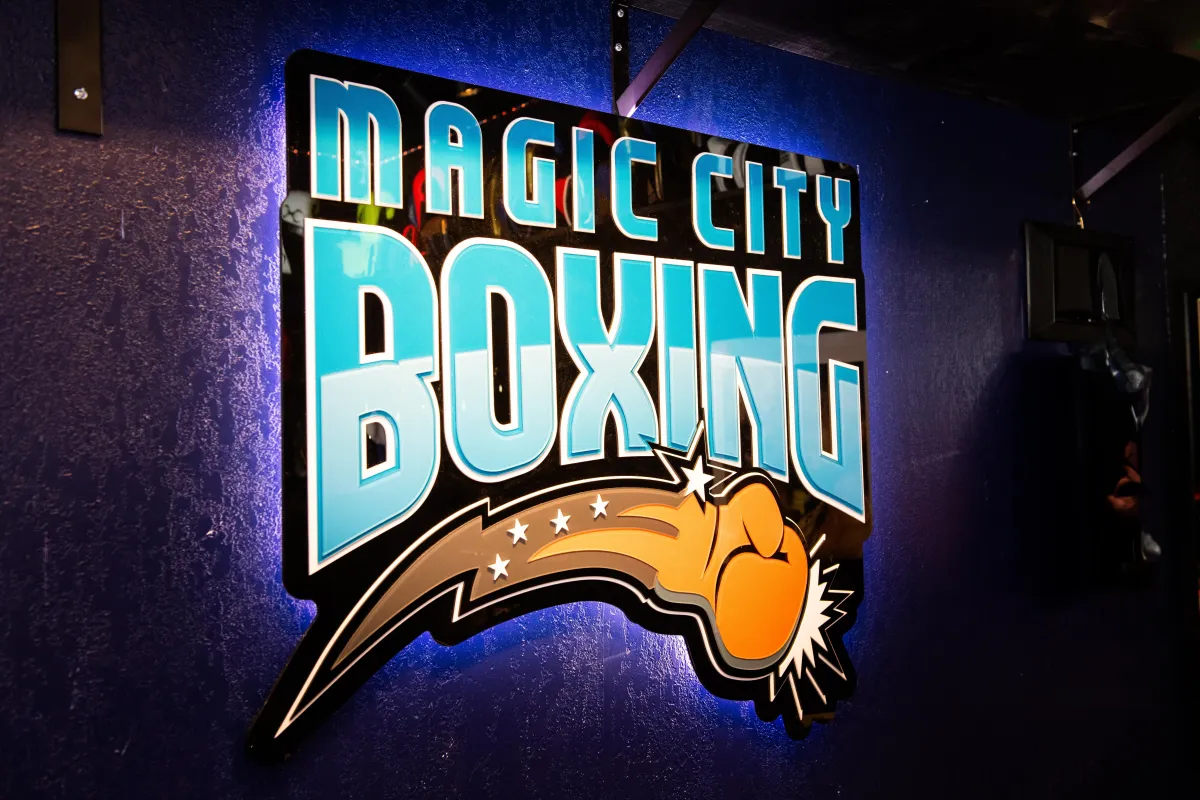 class pass photo Sideways shot of concentrated serious afro american kid in sports clothes keeping feet on floor<br />